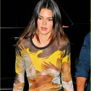 Vintage 90s Jean Paul Gaultier mesh long sleeve top from the Soleil line.